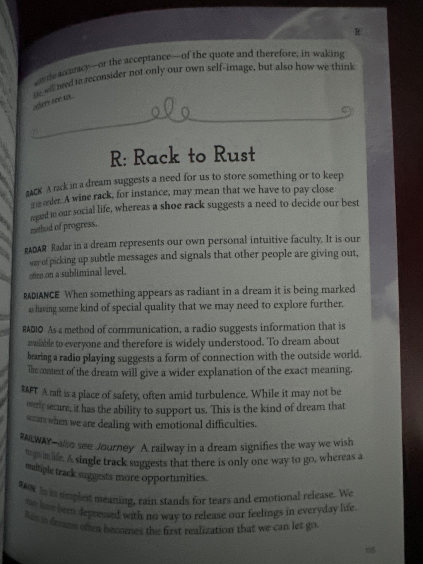 Book page with dream interpretation entries, focusing on R Rack to Rust.