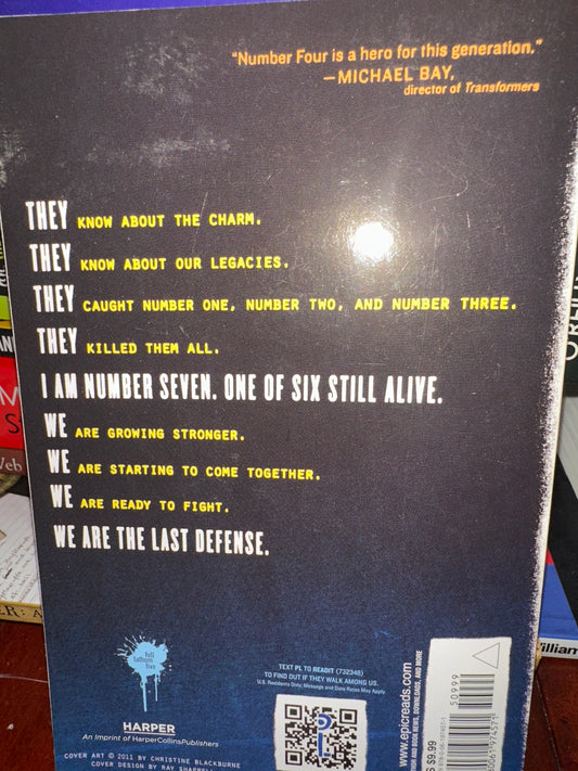 Back cover of I Am Number Seven book with motivational text and quote.