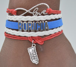 Red, white, and blue braided bracelet with Boricua charm.