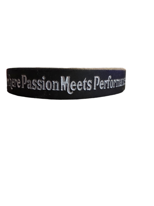 Black wristband with Where Passion Meets Performance text.