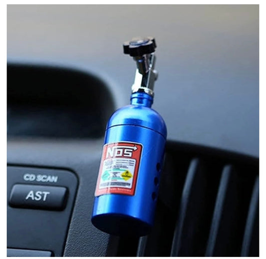 Blue NOS nitrous oxide bottle with clamp in car interior.