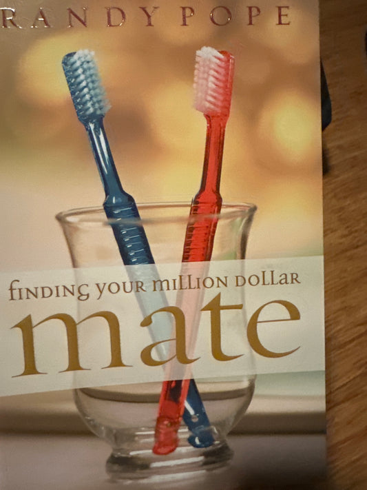 Book cover showing two toothbrushes in a glass, titled Finding Your Million Dollar Mate by Randy Pope.