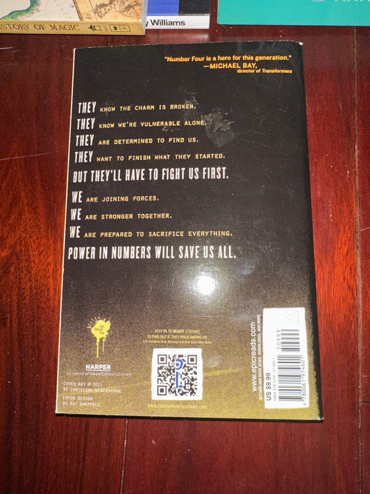 Back cover of I Am Number Four book with motivational text and barcode.