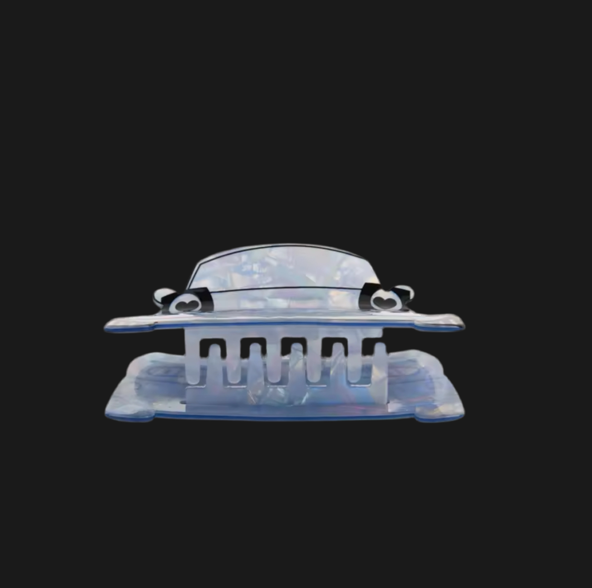 Transparent plastic car-shaped hair clip with heart-shaped eyes on a black background.