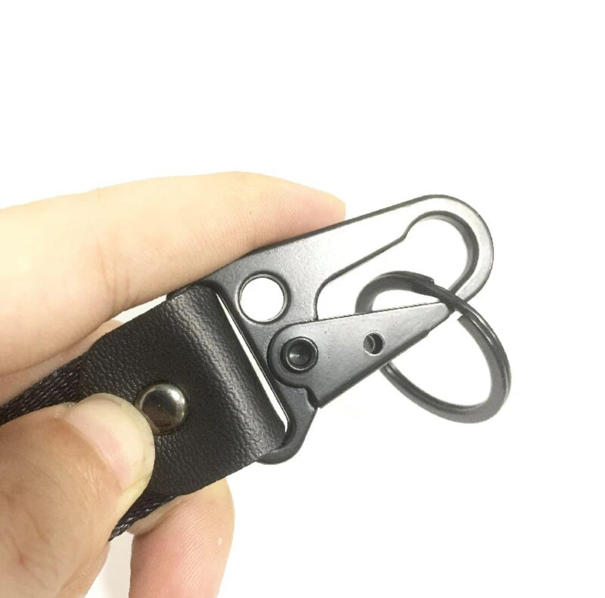 Black leather keychain with metal clip and ring.