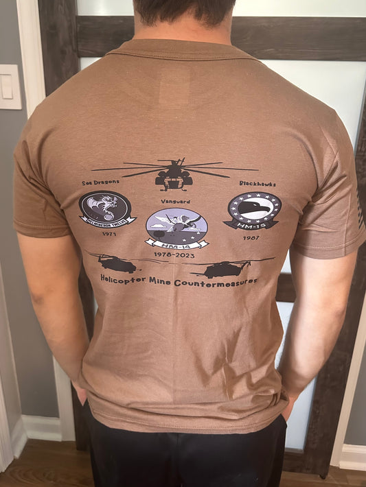 Back of brown t-shirt featuring military helicopter and emblem designs.