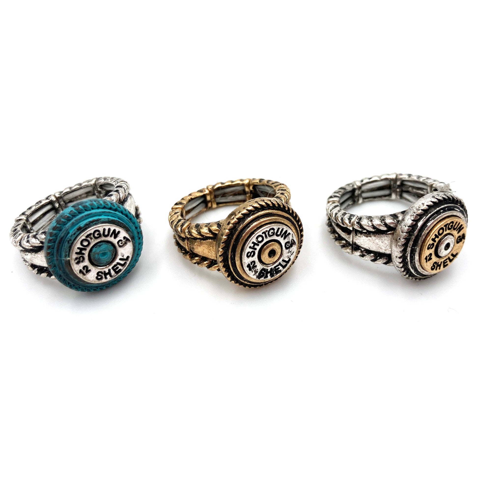 Three rings with shotgun shell designs in teal, gold, and silver.
