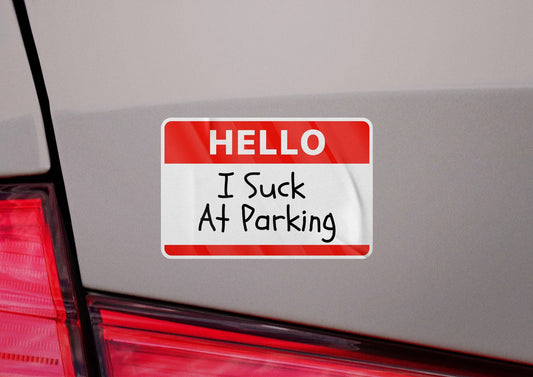 Red and white bumper sticker on car reads HELLO I Suck At Parking