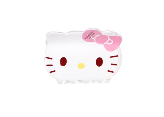 White Hello Kitty-shaped hair clip with pink bow and red eyes.