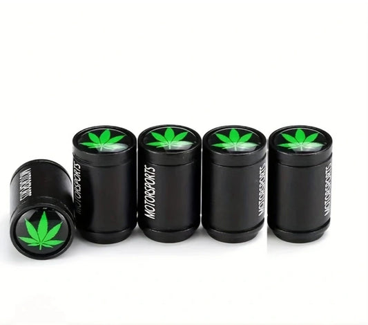 Black Motorsports valve caps with green cannabis leaf design.