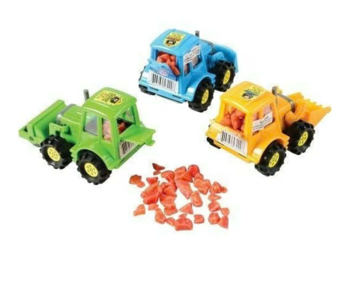 Three toy construction vehicles with red rocks in front.