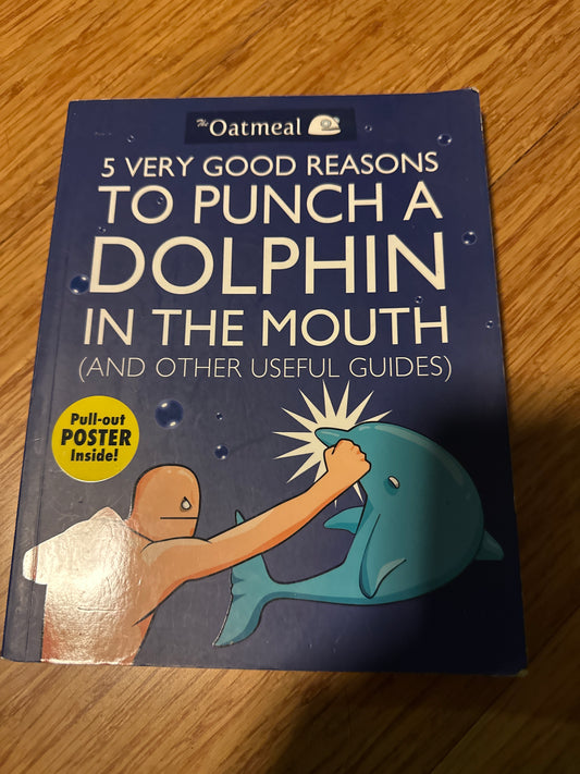 Book cover 5 Very Good Reasons to Punch a Dolphin in the Mouth by The Oatmeal, featuring an illustration of a person punching a dolphin.