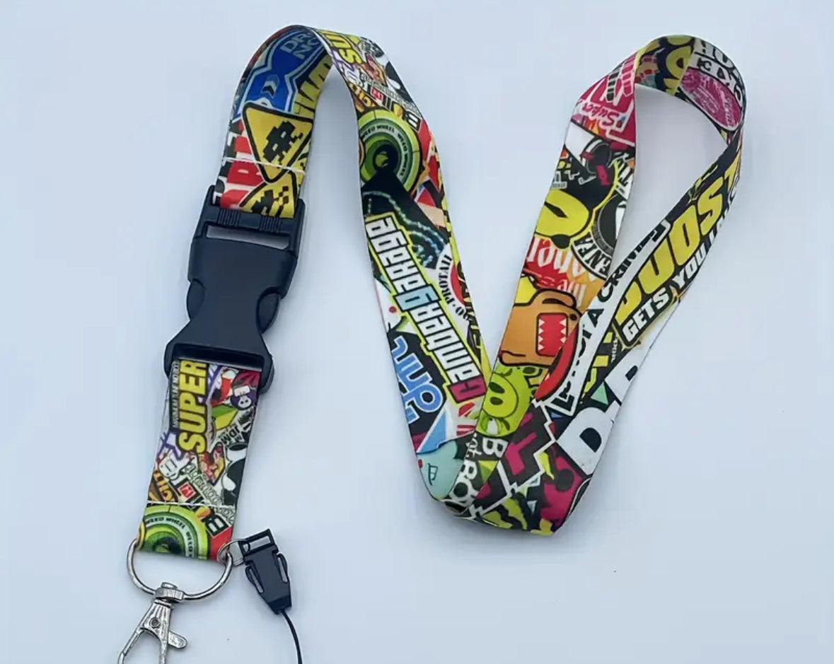 Colorful comic-themed lanyard with adjustable buckle and key clip.