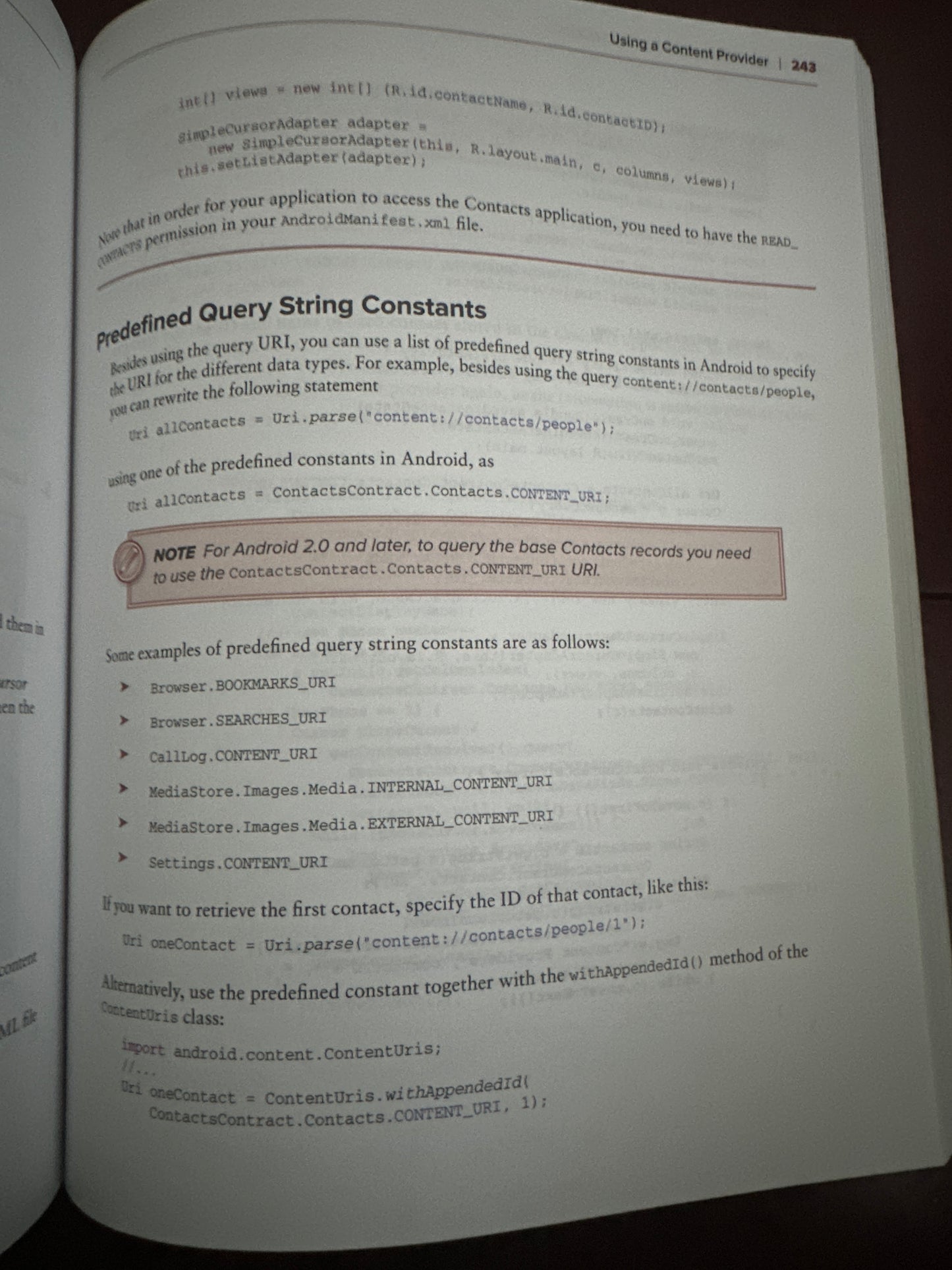 Open book page explaining predefined query string constants in Android programming.