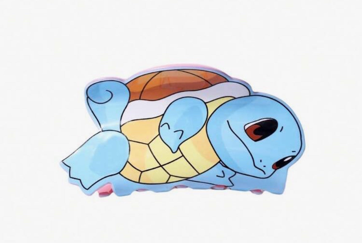 Cartoon blue turtle with yellow shell and brown accents.