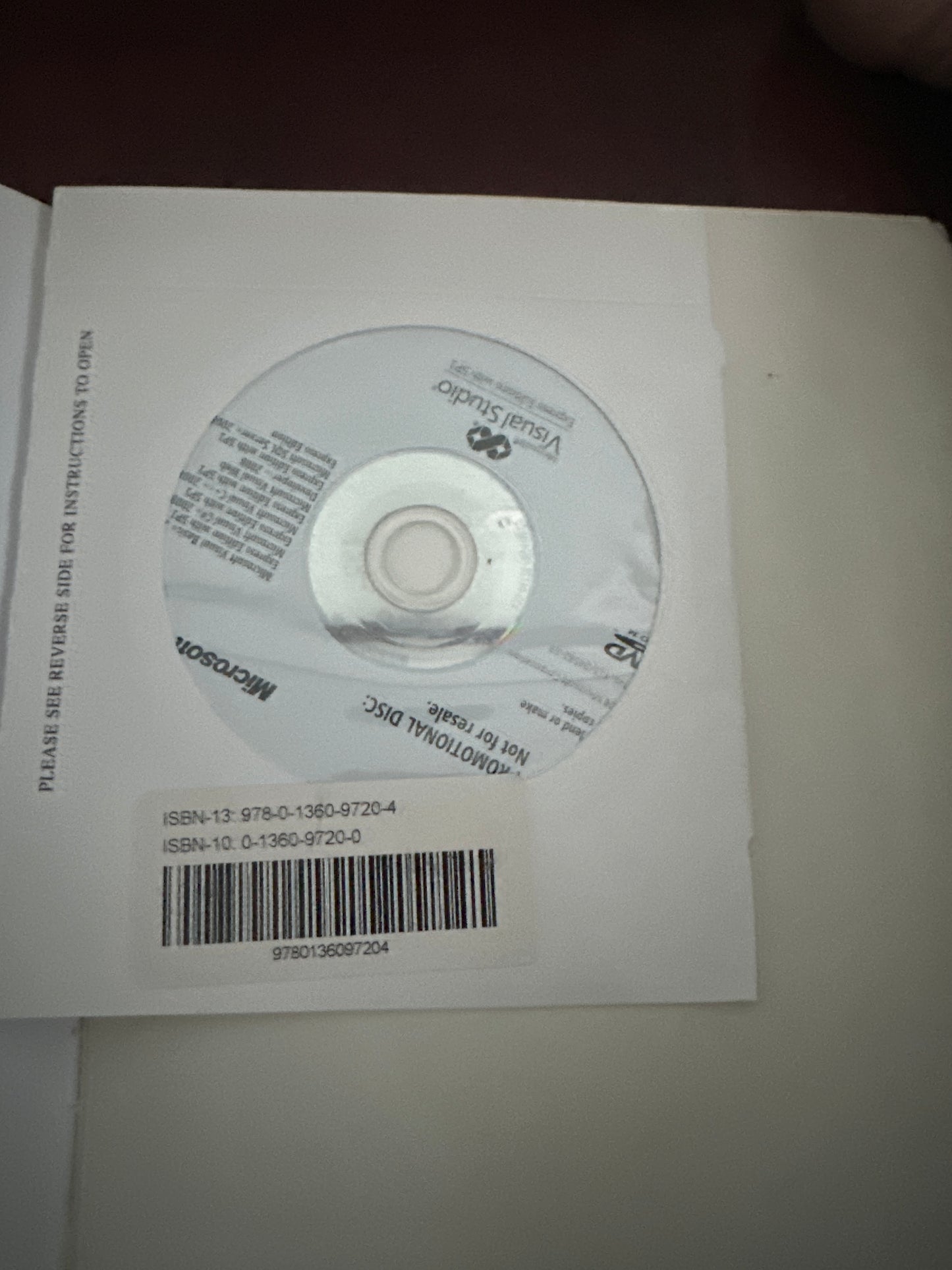 Microsoft Visual Studio promotional CD in white case with barcode.