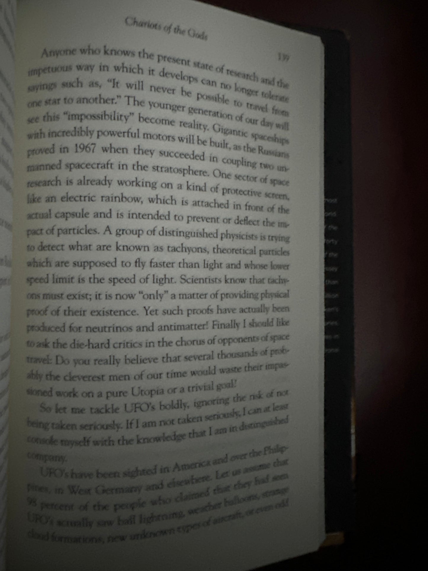 Open book page discussing space travel and UFOs, page 19.