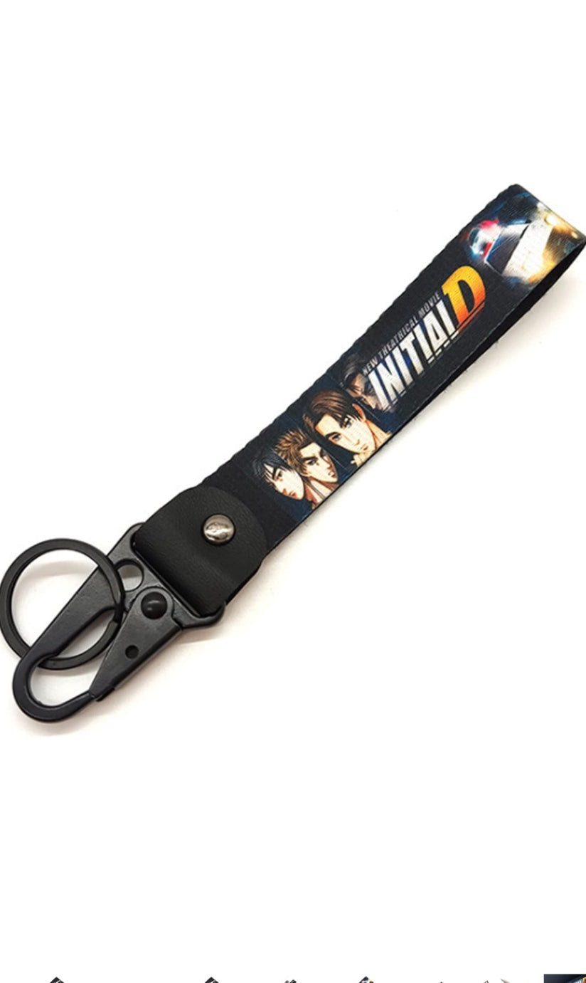 Black Initial D keychain with anime characters and movie title.
