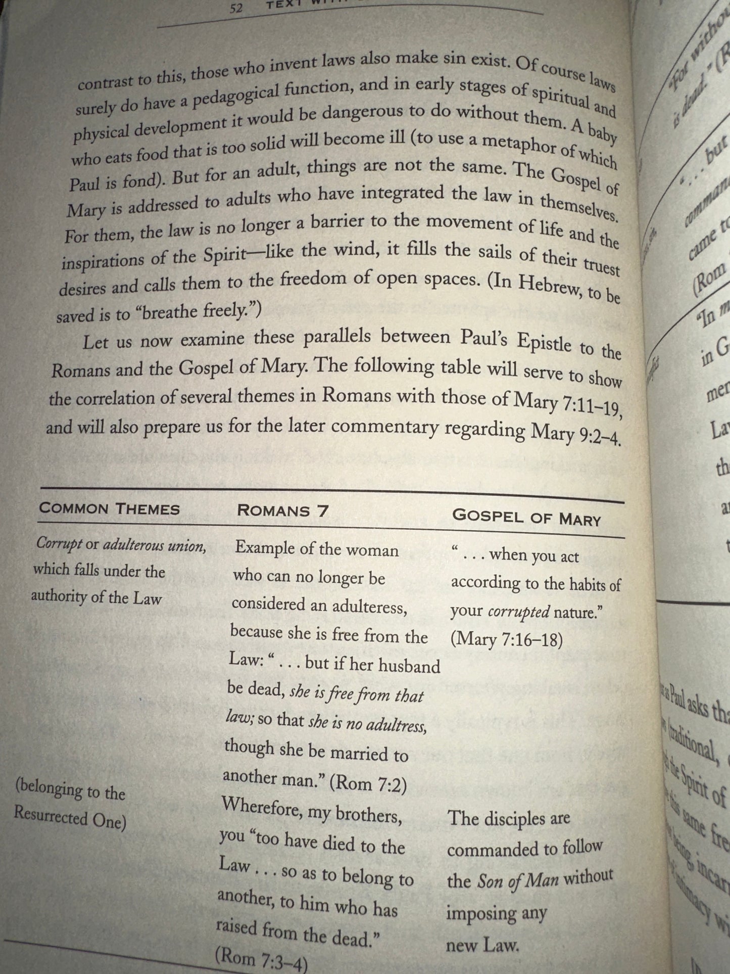 Open book page comparing themes from Romans and the Gospel of Mary.