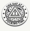 Circular sticker with a triangle and moon, text reads ONE DAY AT A FUCKING TIME.