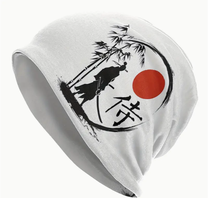 White beanie with samurai silhouette, bamboo, and red sun design.