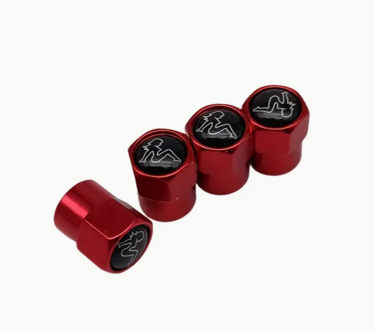 Red car tire valve caps with woman silhouette logo.