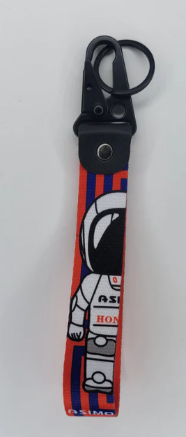 Red and blue astronaut-themed lanyard with black clip.