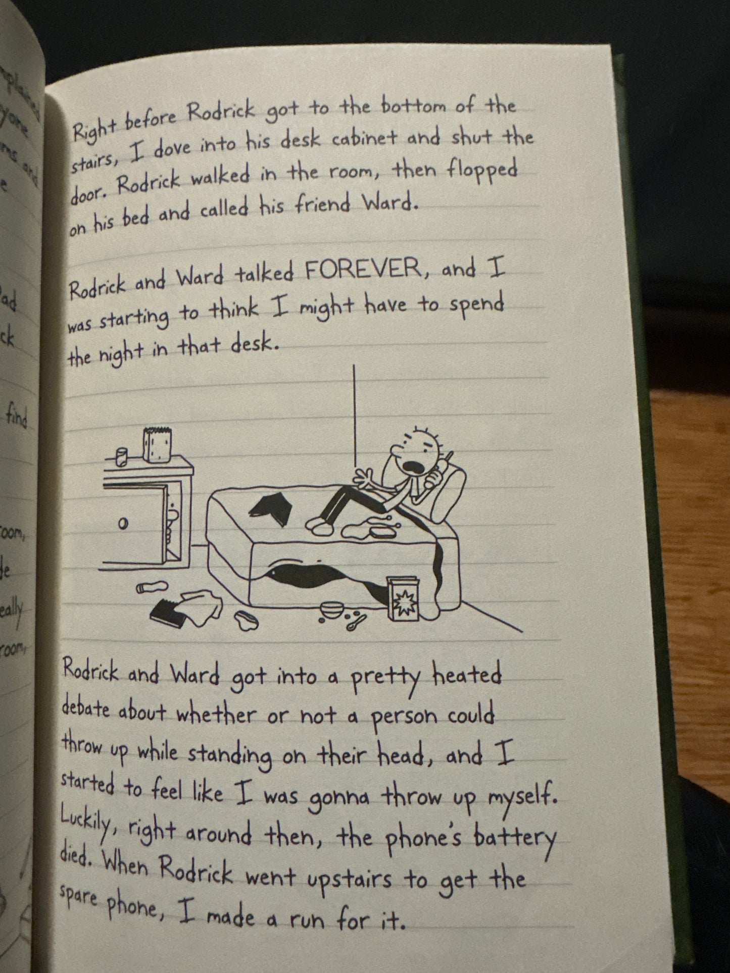 Hand-drawn cartoon of boy on couch, surrounded by clutter, in a notebook page.