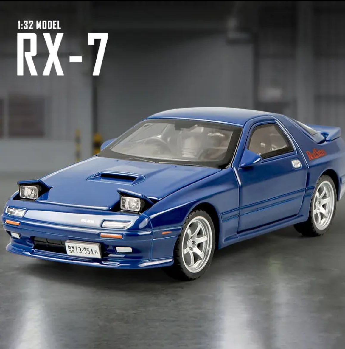 Blue 132 scale RX-7 model car with silver rims.