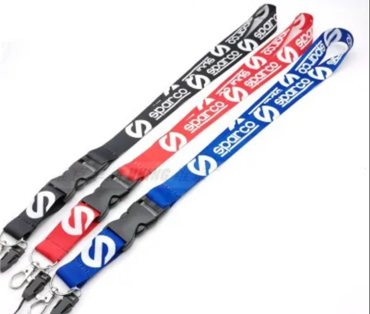 Sparco lanyards in black, red, and blue with logo.