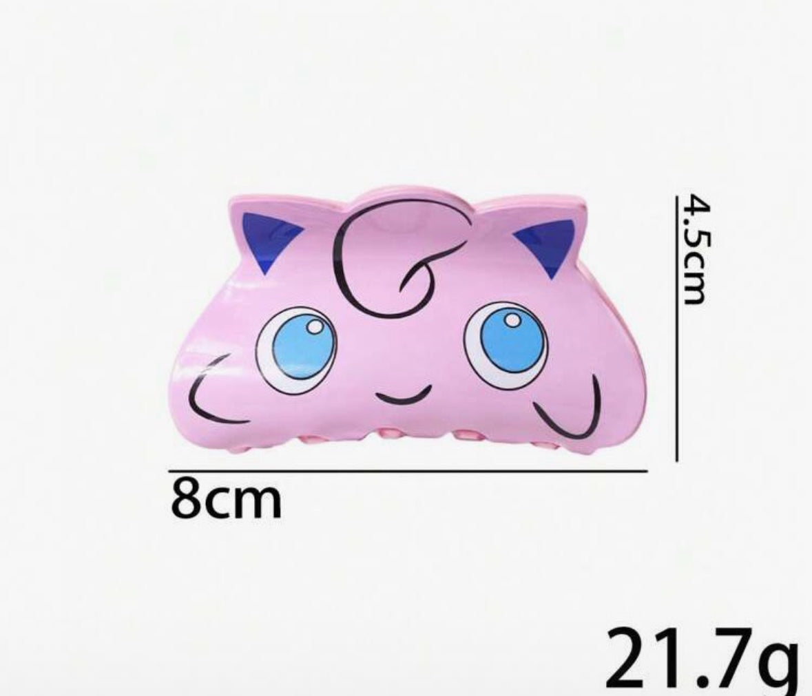 Pink Jigglypuff-shaped plush toy with blue eyes and ears, dimensions 8cm x 4.5cm.