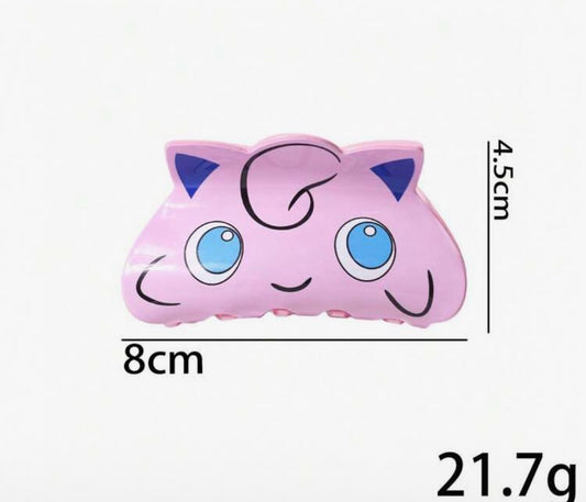 Pink Jigglypuff-shaped plush toy with blue eyes and ears, dimensions 8cm x 4.5cm.