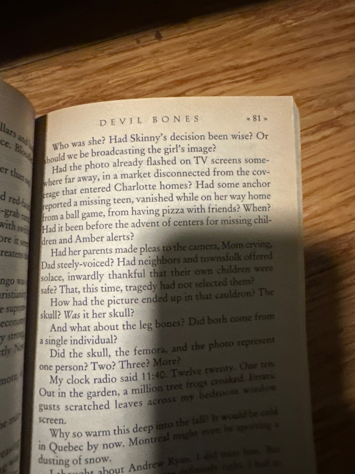 Open book titled Devil Bones on a wooden surface, page 81.