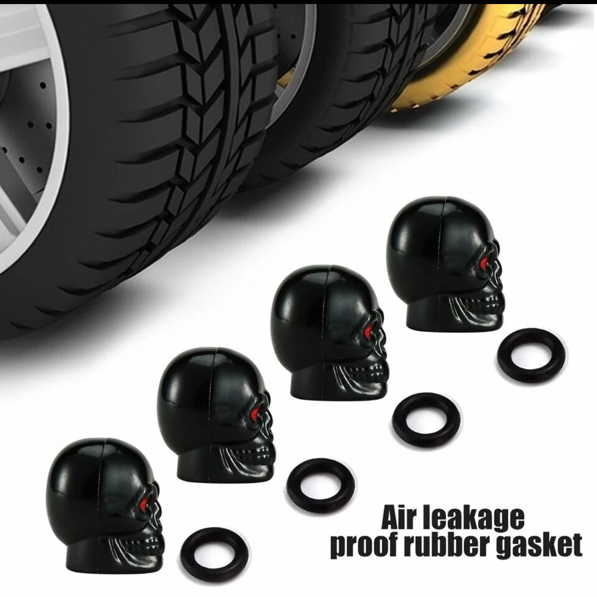 Black skull-shaped tire valve caps with red eyes and rubber gaskets.