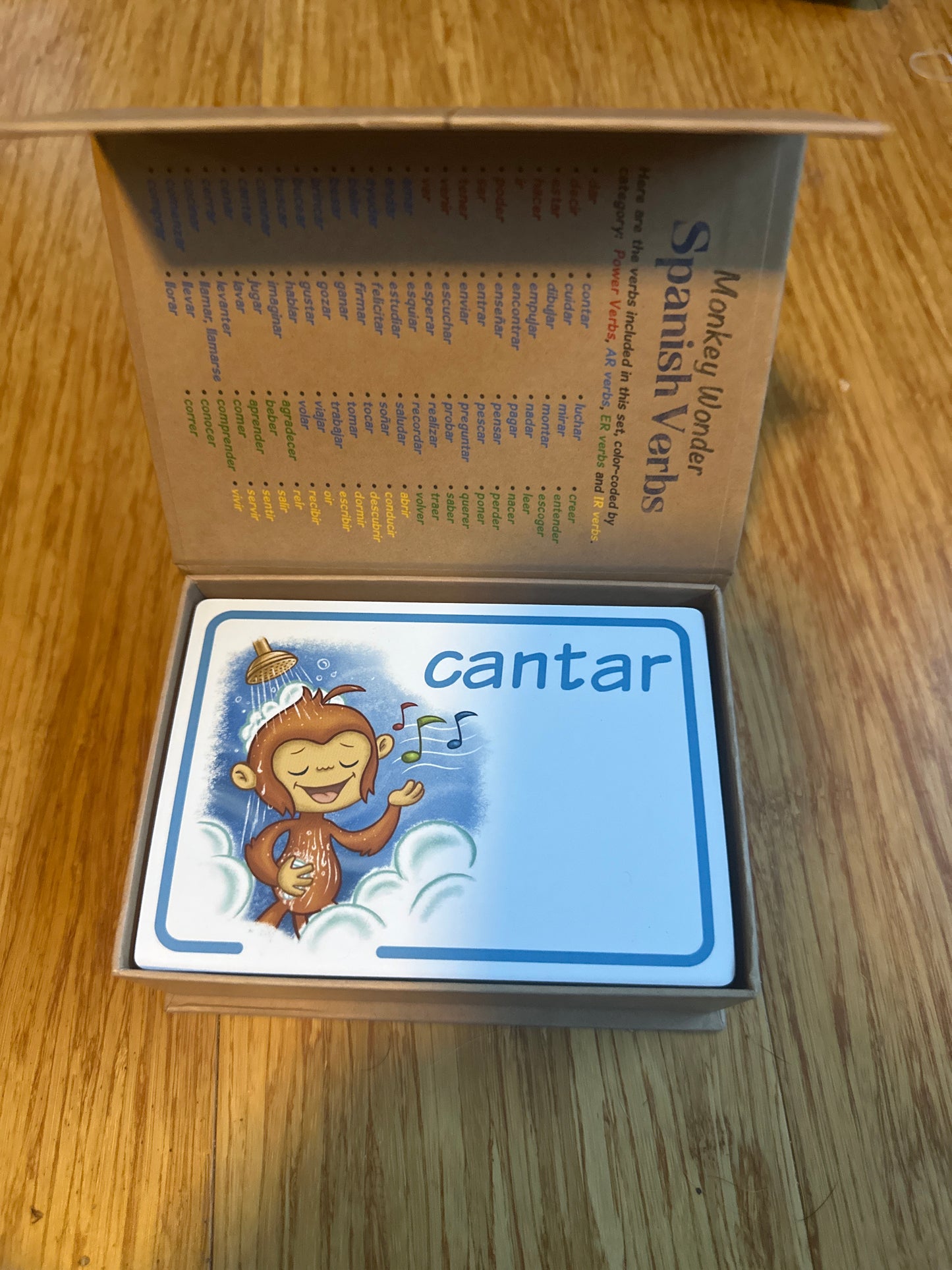 Monkey-themed Spanish verb flashcard set with cantar to sing