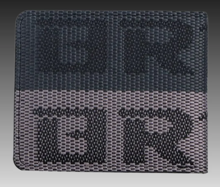 Gray woven wallet with black and white patterned design.