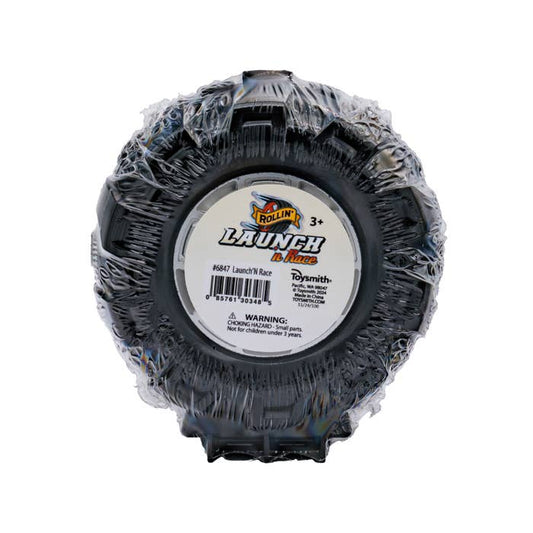 Black plastic toy tire with Launch n Race label and warning sticker.