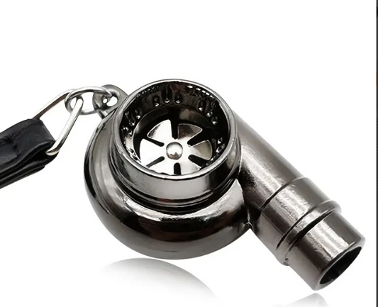 Black metal whistle with keychain and leather strap.