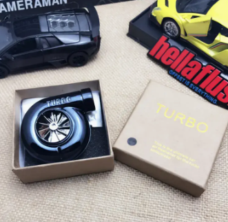 Black turbocharger model in box with TURBO text.