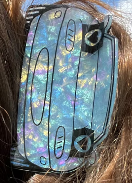 Holographic visor with abstract design on persons head.