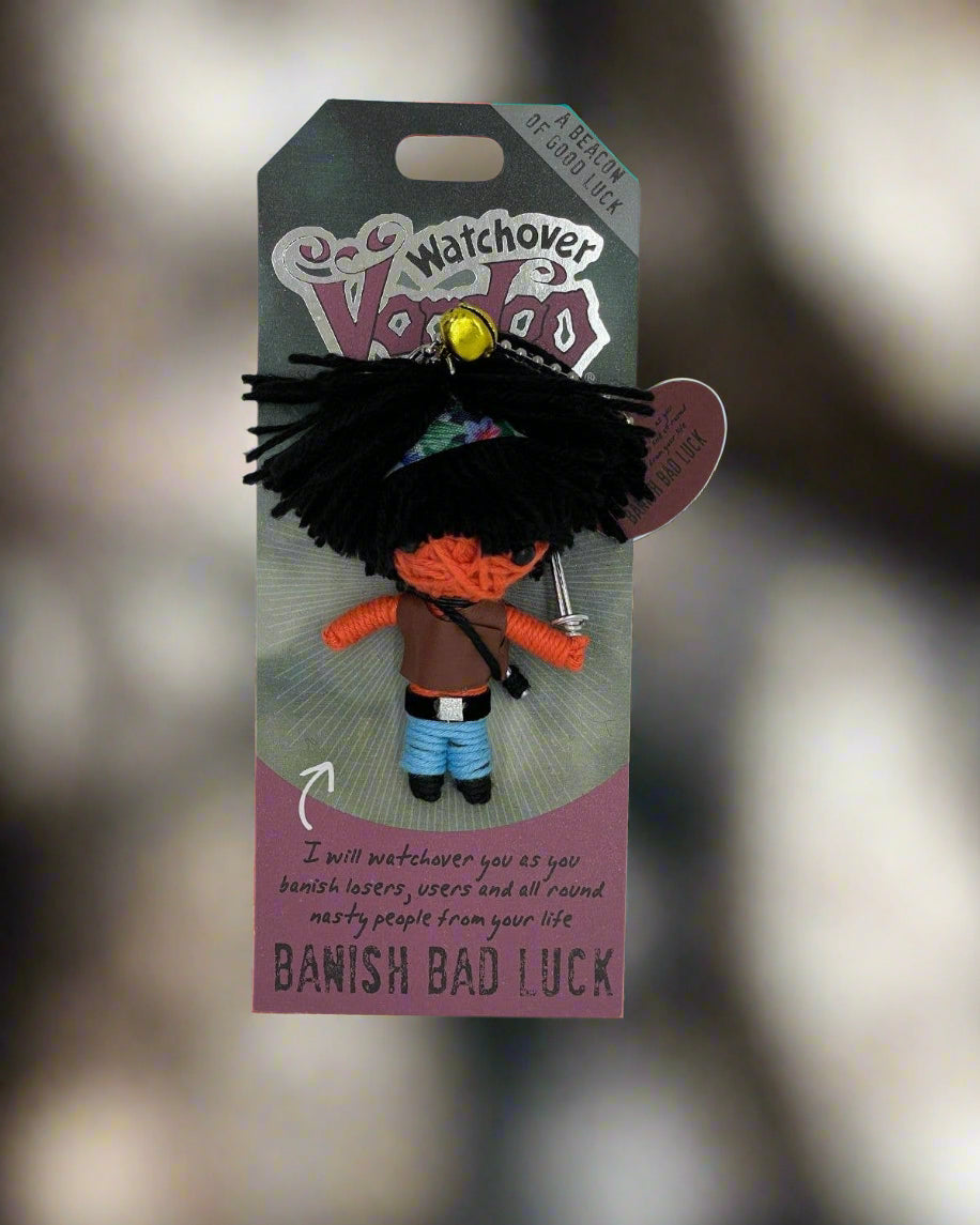 Watchover Voodoo doll with black hair, orange arms, and a sword on packaging.