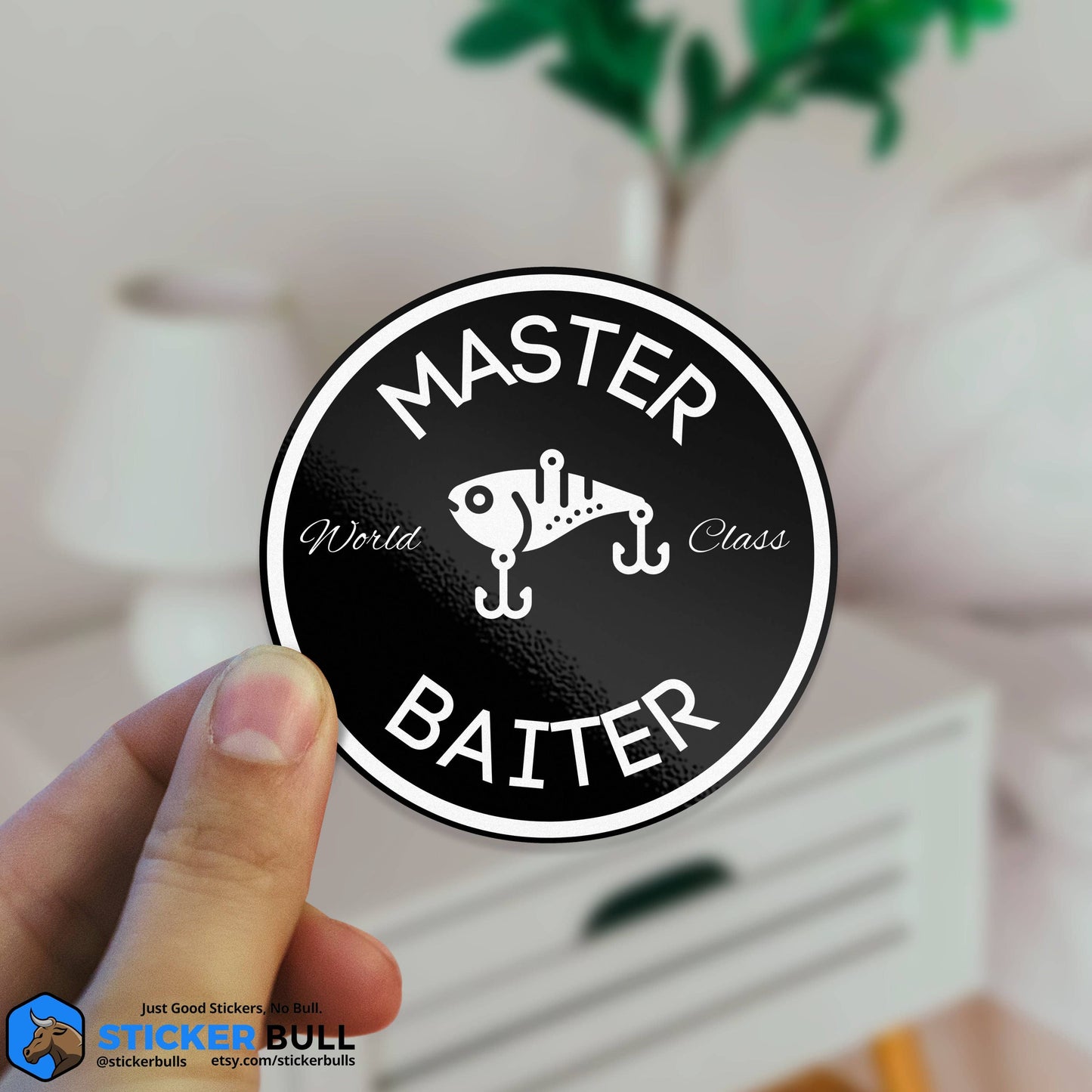 Circular sticker with Master Baiter text and fishing lure design.
