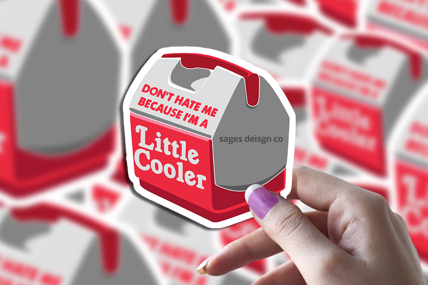Hand holding a sticker shaped like a mini cooler with text Dont hate me because Im a Little Cooler