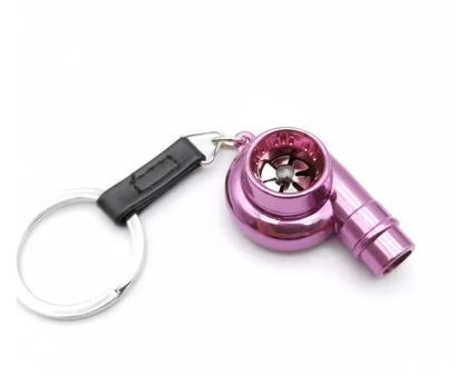 Pink mini turbo keychain with black strap and ring.