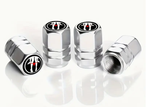 Chrome car tire valve caps with red and black logo.
