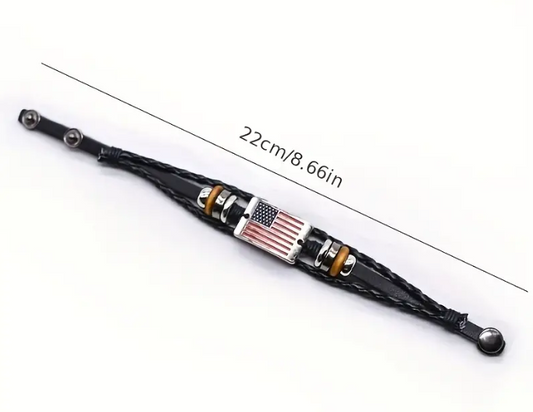 Black leather bracelet with American flag charm, 22cm long.