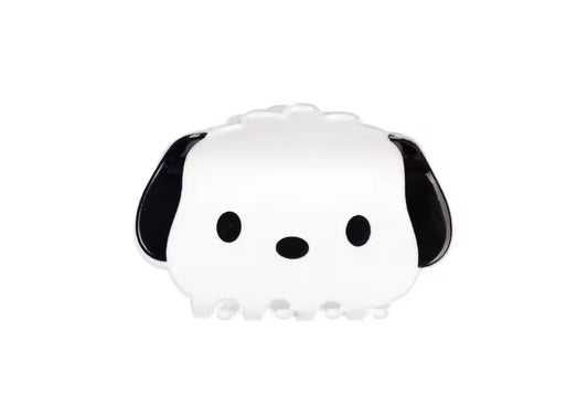Cute black and white dog-shaped decorative object with fluffy ears.