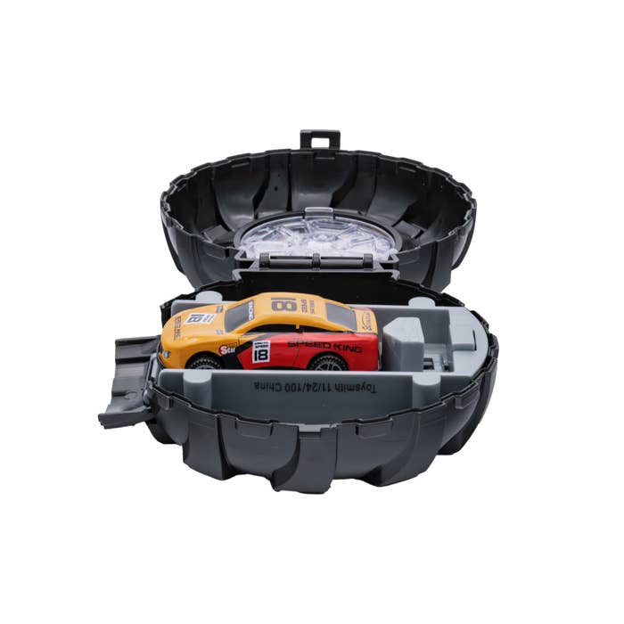 Yellow and red toy race car in black storage case.