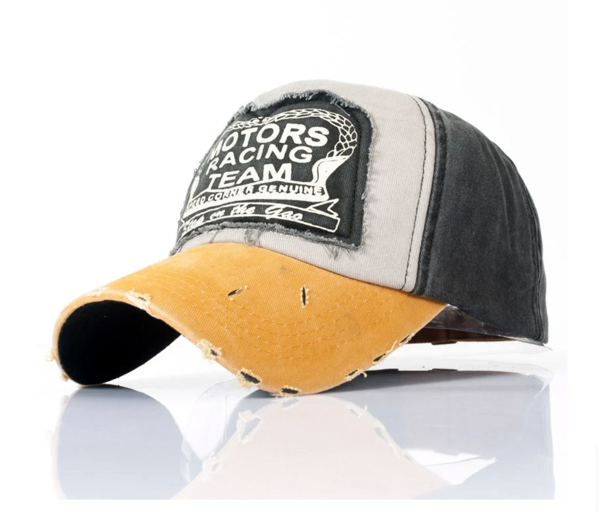 Vintage distressed baseball cap with Motors Racing Team patch.