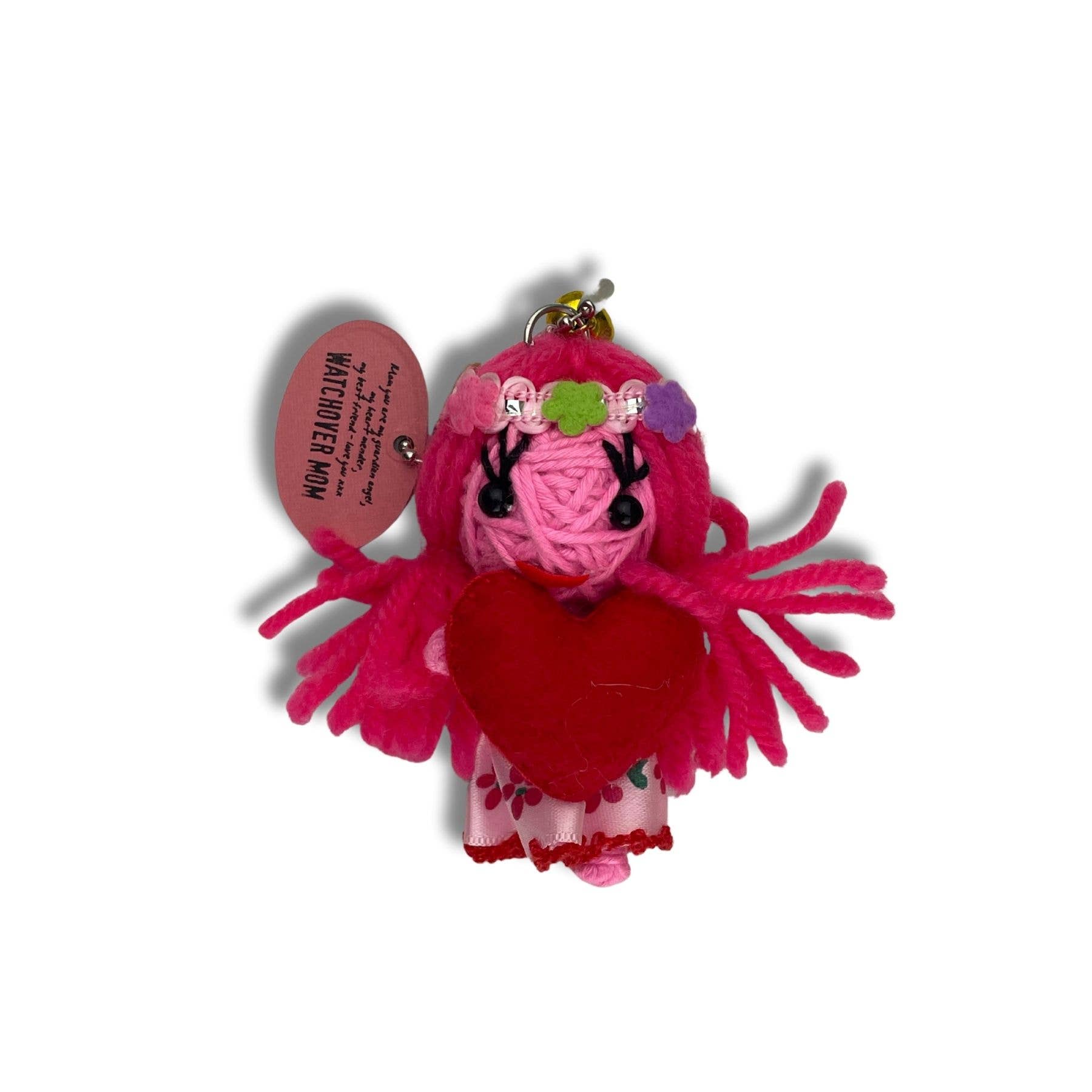 Pink yarn angel keychain with heart and flower details.